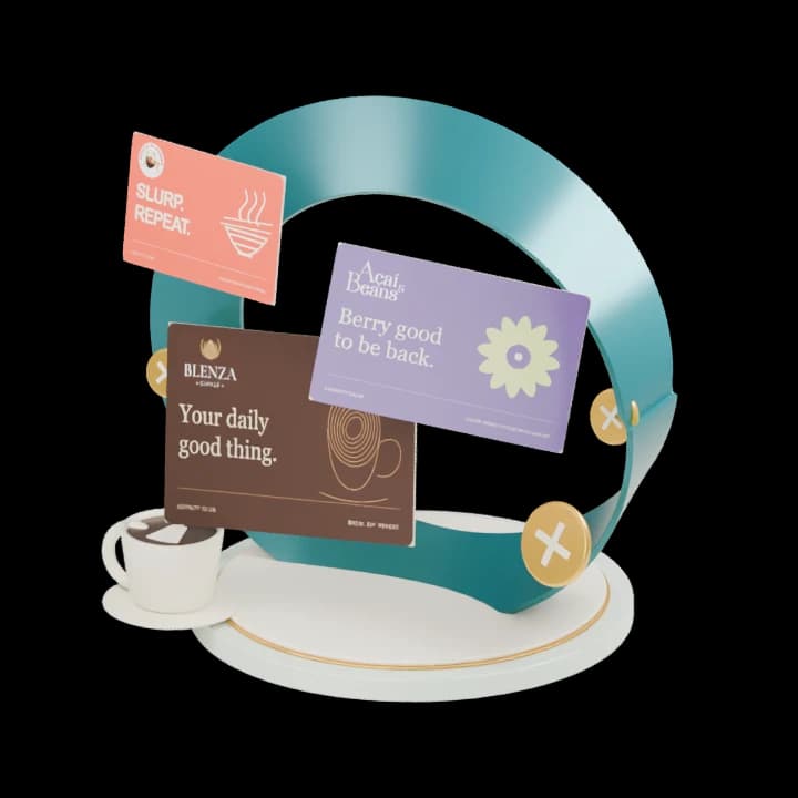 A sculpted teal loyalty loop with custom Blenza Coffee, Açaí & Beans and Sejong-Si Ramyun cards, a porcelain coffee cup and brass reward tokens