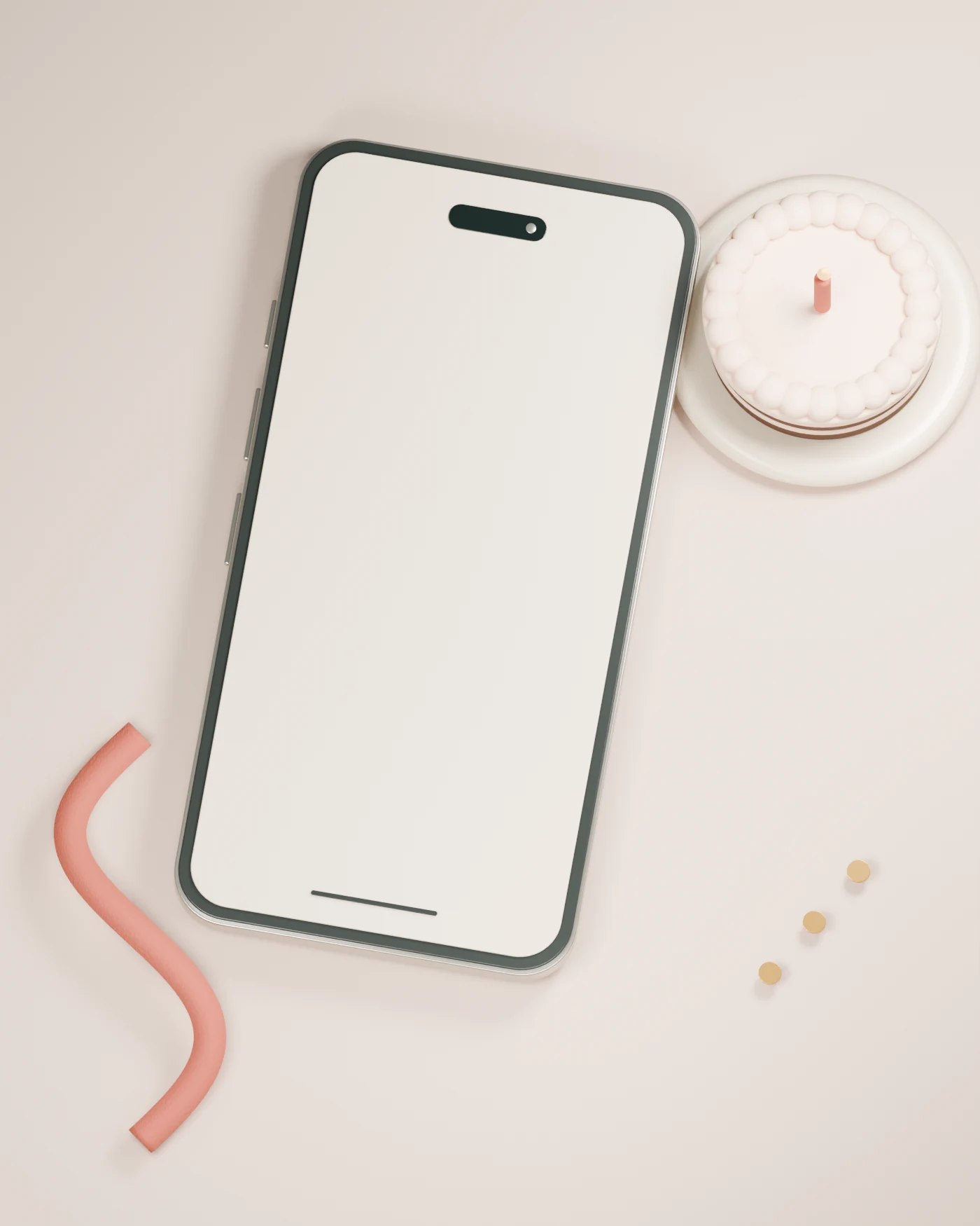 A titanium phone beside a candle-topped cake, porcelain plate and unrolled birthday ribbon.